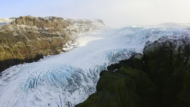 Drone Of Sunlit Mountainside To The Side Of Vatnajokull Glacier