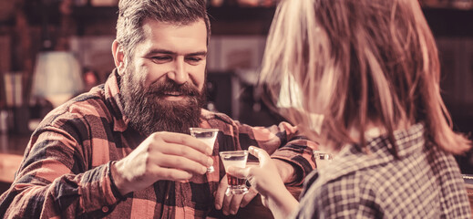 Young people at the party drink alcohol. Woman alcoholic beverage in bar. Young woman has problems with alcohol. Female male alcoholism. Young man drinking alcohol