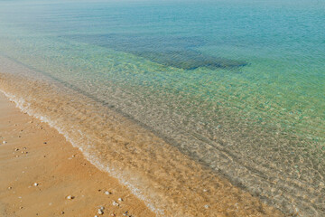 Fototapeta na wymiar Beautiful sand beach and turquoise water sea. Greece. Amazing backgrounds.