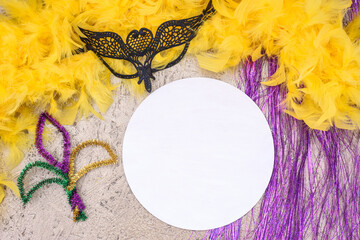 Mardi Gras Mockup, Wooden empty round sign with mask and colorful decor on golden background,...