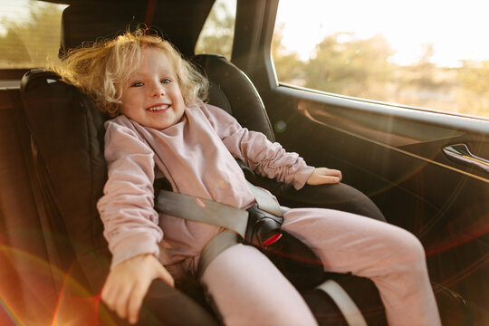 Cute girl in child seat during trip
