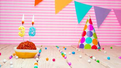 Happy birthday for 38 years old. Festive background with muffin. Copy card birthday for thirty eight years on a pink background