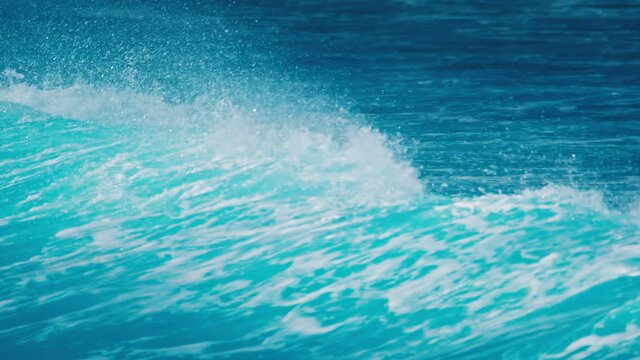 Ocean wave breaks on the shore in Maldives