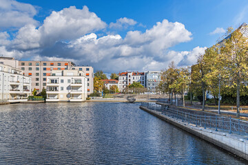 Harbor basin Tegeler Hafen with old and modern buildings in Berlin, Germany
