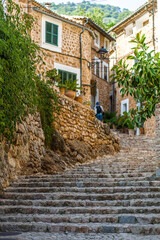 Fototapeta na wymiar Romantic and cosy streets and views in the picturesque small town Fornalutx, Majorca, Spain