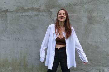 portrait of a girl in white shirt, concrete background