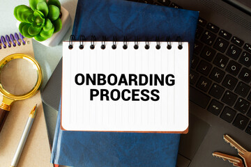 Closeup on businessman holding a card with ONBOARDING PROCESS message, business concept