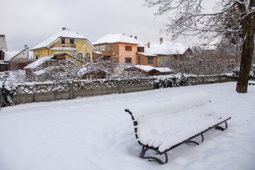 snow and houses in the park in January 2022, Romania Bistrita 
