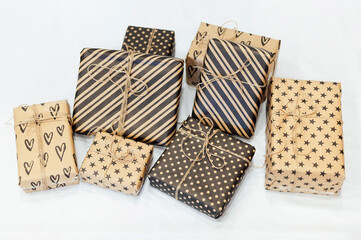 Gifts in eco-friendly paper packaging on a white background. Concept minimalism
