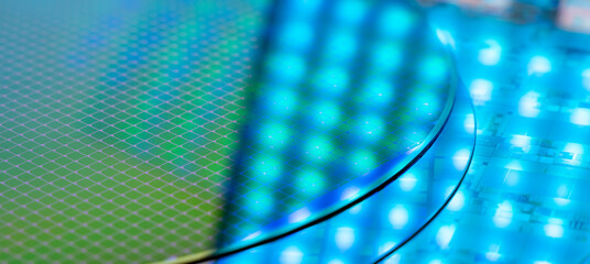 Silicon Wafers with microchips used in electronics for the fabrication of integrated circuits