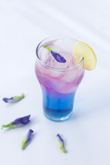 cocktail with ice and lime from butterfly pea flower (asian pigeonwings)