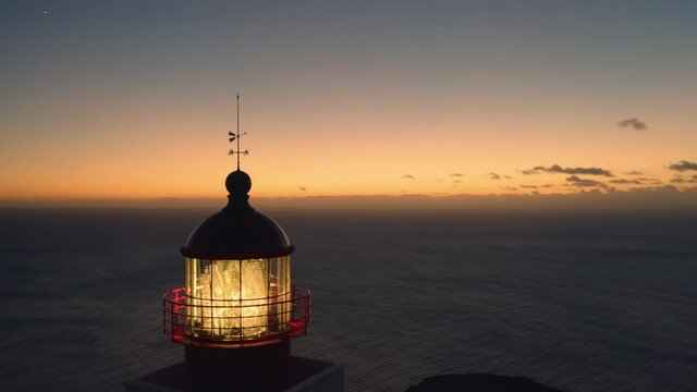 Panoramic aerial view of the lighthouse with the ocean in the background at sunset