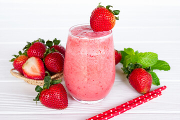 Strawberry yogurt fruit juice smoothie pink colorful fruit juice milkshake blend beverage healthy high protein the taste yummy In glass drink episode morning on white wood background.