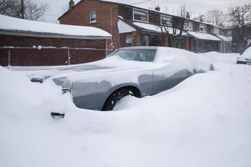 Toronto, Ontario / Canada - January 17, 2022 - Toronto St Clair West car covered with snow on day of snowstorm