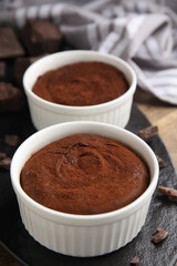 Delicious fresh fondant with chocolate chunks on table, closeup