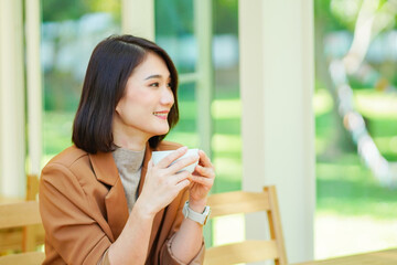 woman drinking coffee in cafe