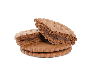 Broken tasty chocolate sandwich cookies with cream on white background