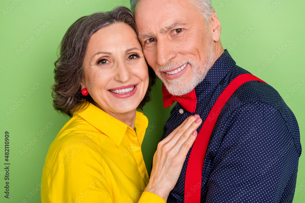 Canvas Prints Cropped close up photo of two charming positive soulmates hug look camera isolated on green color background