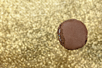brown chocolate dessert delicious macaroon on a golden white background