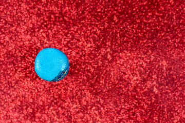 delicious sweet dessert blue berry, blueberry macaroon on a red shiny background