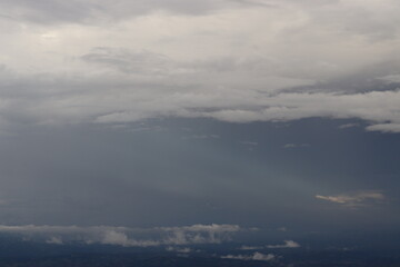 Photo taken from the top of Phu Thap Boek, Thailand. Cloud and mist are seen, the light shines through, giving a feeling of coolness and relaxation. Ideas for vacation travel and wallpaper images.