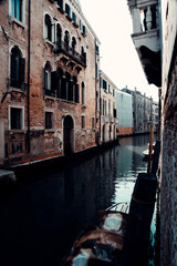 Fototapeta na wymiar Small Canal and Old Buildings in Venice, Italy