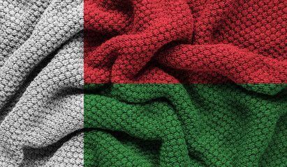 Madagascar flag on knitted fabric. 3D-image