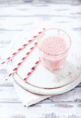  Strawberry Smoothie on bright wooden background.