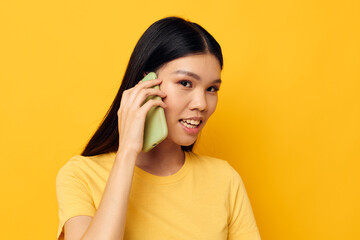 woman with Asian appearance phone communication fun use studio model unaltered