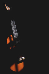 A guitar in the shadows