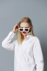 pretty woman in white shirt sunglasses isolated background