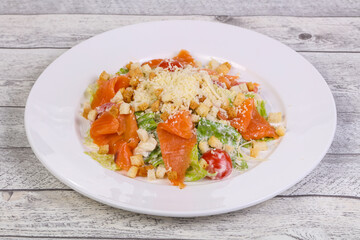 Caesar salad with salmon and parmesan