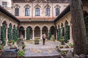 Woman Contemplating The Architecture Of A Famous Building In Bucharest Capital Of Romania. Young...