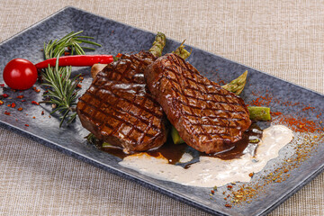 Grilled beef steak served pepper