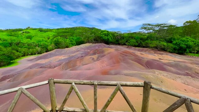 The family admires the famous place. Seven coloured earths. A formation in nature that has become a huge tourist attraction on island Mauritius