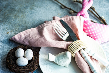 Easter table setting on concrete background