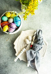 Easter table setting on concrete background