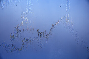 frost patterns on window glass, abstract background winter rime snow