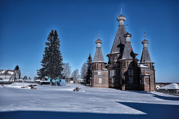 wooden church in the Russian north landscape in winter, architecture historical religion Christianity