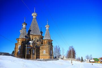 wooden church in the Russian north landscape in winter, architecture historical religion Christianity