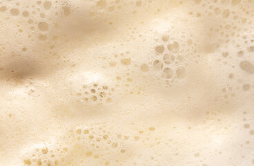 Fototapeta na wymiar White foam in boiling water as an abstract background.
