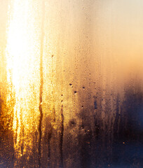 Frozen glass of a window at dawn.