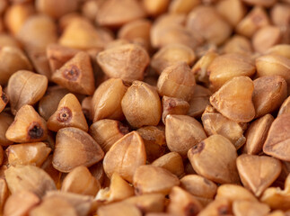 Close-up of buckwheat groats as background.