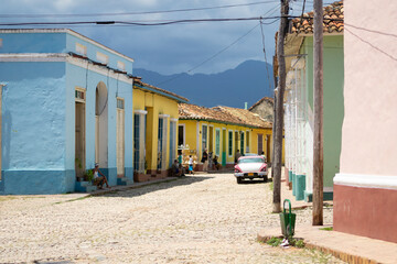 Scene on the street with colorful houses in the center of Trinidad, Cuba.