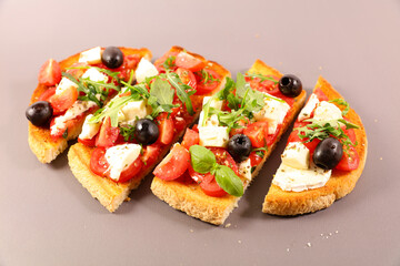 bruschetta or tapas, toast with tomato,  mozzarella and basil