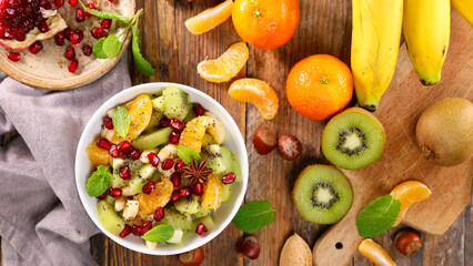 bowl of fruit salad and ingredients