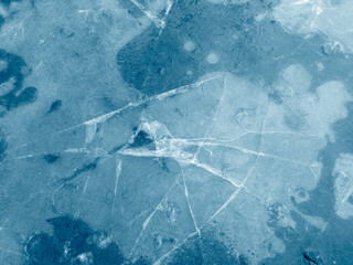 Cracked ice in a puddle.