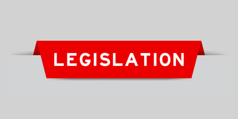 Red color inserted label with word legislation on gray background