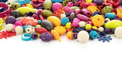 Fototapeta na wymiar Children's plastic constructor. Background of bright multi-colored beads