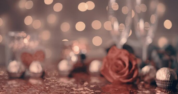 romantic dinner for two in honor of valentine's day. background with beautiful bokeh place for text and romantic dinner accessories. 14 february valentine's day celebration concept
